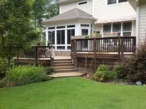 Backyard of a house with a large brown deck