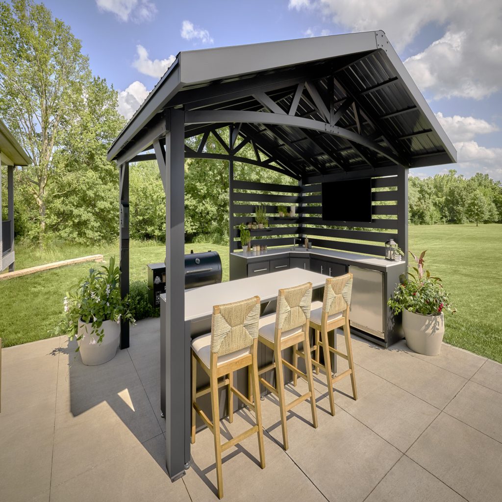 Langston black galvanized steel outdoor kitchen pavilion with integrated bar seating and grill station, installed by Express Sunrooms of Charleston.